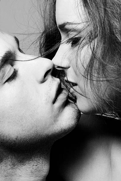 Portrait of Young Couple About to Kiss, Black and White stock photo