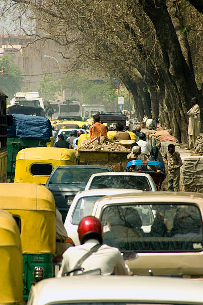 istock Traffic on Tree-Lined Road in New Delhi, India 108162705