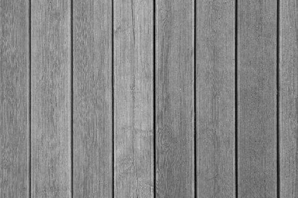 istock Vertical gray wooden planks with ribbed surface as texture, background 1081628356