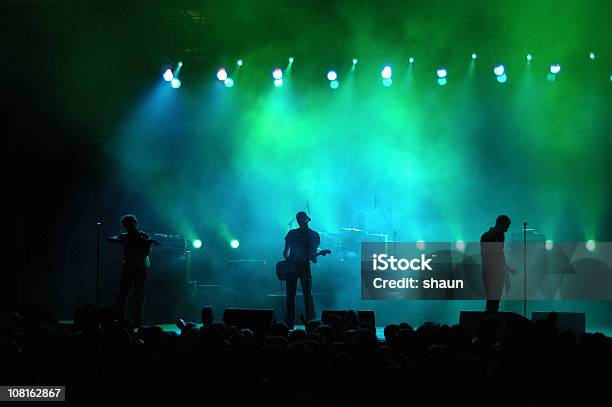 Silhouette Of Band On Stage In Colored Lighting Stock Photo - Download Image Now - Music Festival, Green Color, Music