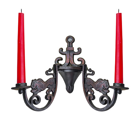 Wall candlestick in vintage style with two red candles, isolated on a white background (design element)