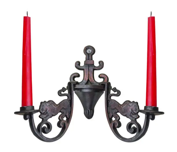 Photo of Wall candlestick in vintage style with two red candles, isolated on a white background