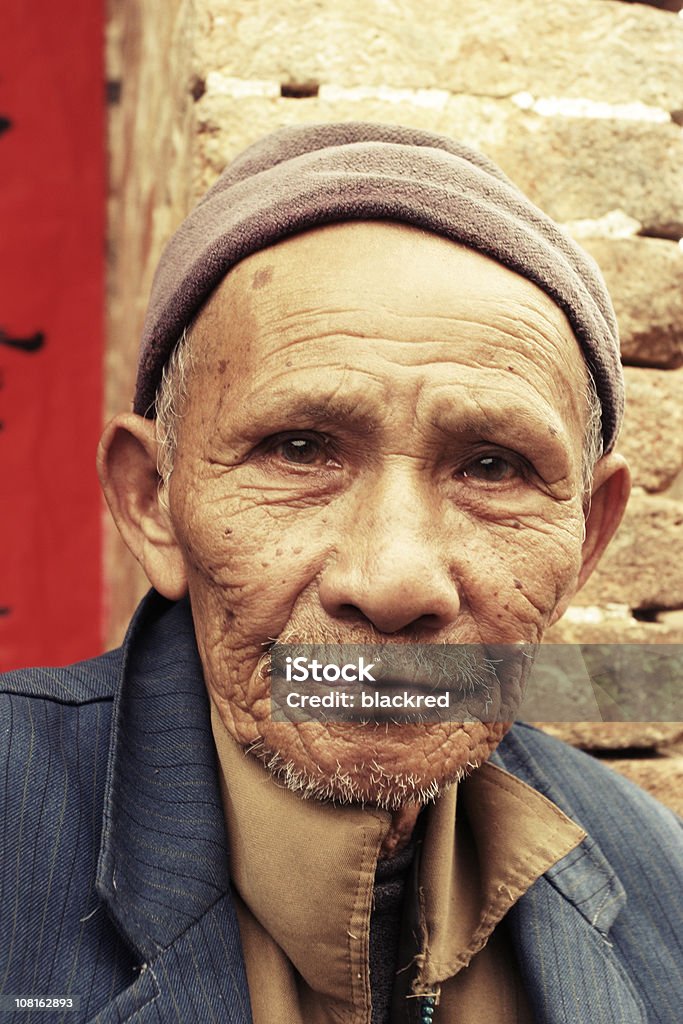 Portrait of Senior Chinese Man Outside Near Building  Homelessness Stock Photo