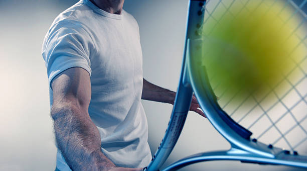 istock Cropped, Male tennis player hitting ball 108162941
