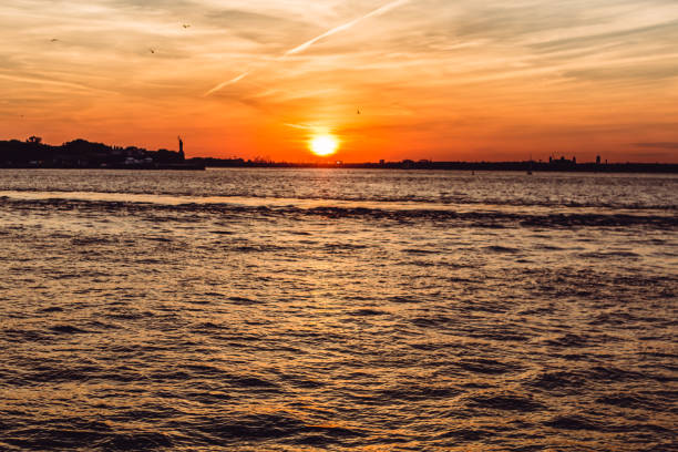 istock Liberty statue, New York City. Panoramic view at sunset from Brooklyn 1081629778