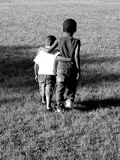 Child girl talking to friend on public park