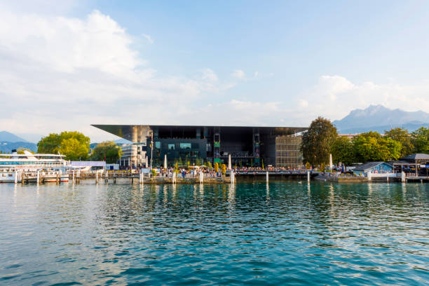 Lucerne Culture and Congress Hall (KKL) in Switzerland Lucerne, Switzerland - August 21, 2018: View of the Lucerne culture and congress hall (KKL). This modern center for congresses and concerts is built on the Lucerne lake shore. Switzerland. It is a multi-functional building with a concert hall that is esteemed for its high-profile acoustics. lucerne switzerland stock pictures, royalty-free photos & images