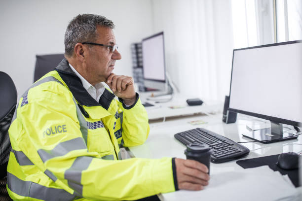 istock Senior traffic warden drinking takeaway coffee 1081634148