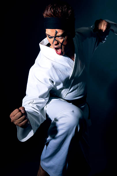 istock Man Wearing Karate Gi and Face Paint Posing 108163542