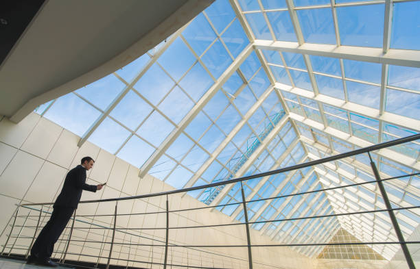 istock The man stand on the office balcony and phone 1081636728