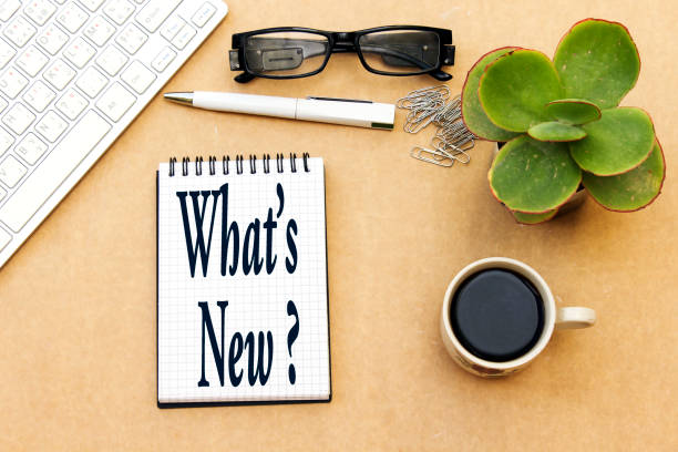 istock what's new ? concept, desktop: notebook and cup coffee, pen, eyeglasses, keyboard ... 1081643666