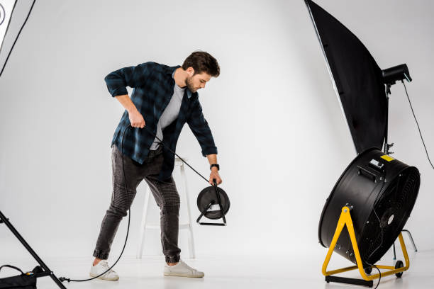 istock young man working with equipment in professional photo studio 1081643818
