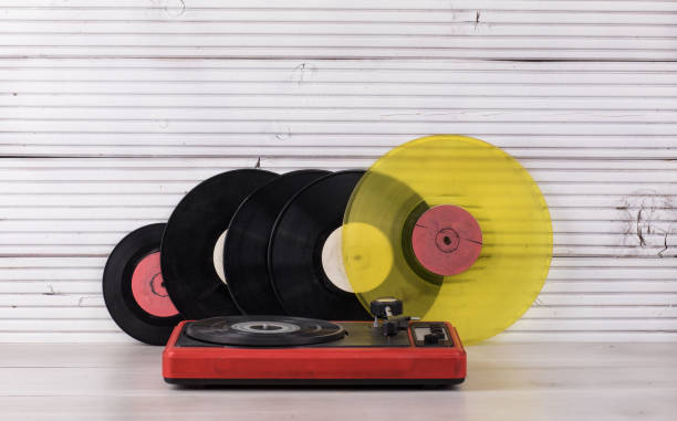 istock vintage turntable on white wooden background 1081646164