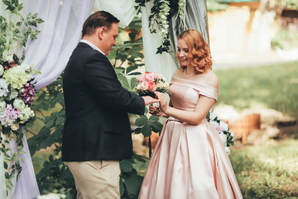 istock bride and groom on wedding ceremony on background nature 1081650790