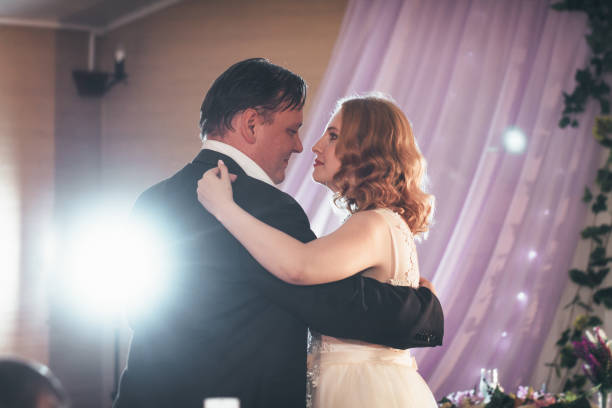 istock bride and groom first dancing on background a restaurant 1081651340