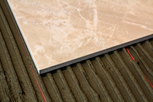 istock Ceramic tiles and tools for tiler. Floor tiles installation. Home improvement, renovation - ceramic tile floor adhesive, 1081655724