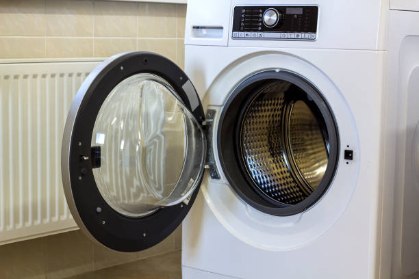 istock A close up of open washing machine in bathroom 1081655782