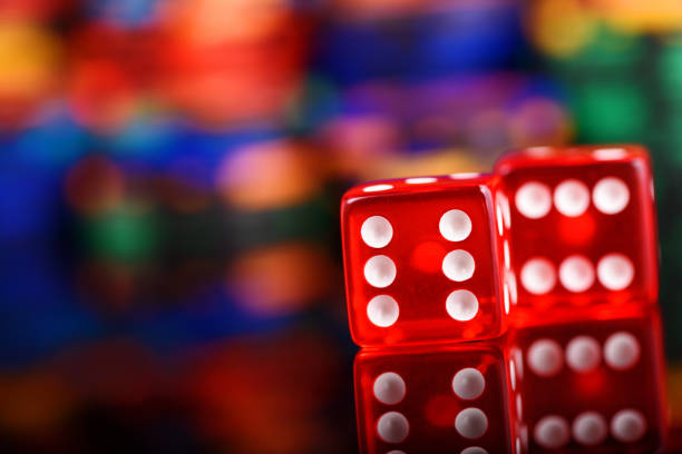 istock casino red dices game on colored blurred background 1081656812