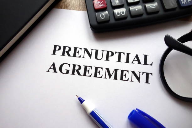 istock Prenuptial agreement, pen, glasses and calculator 1081656926