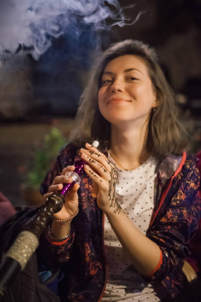 istock Woman enjoy hookah while traveling in Istanbul, Turkey 1081660436