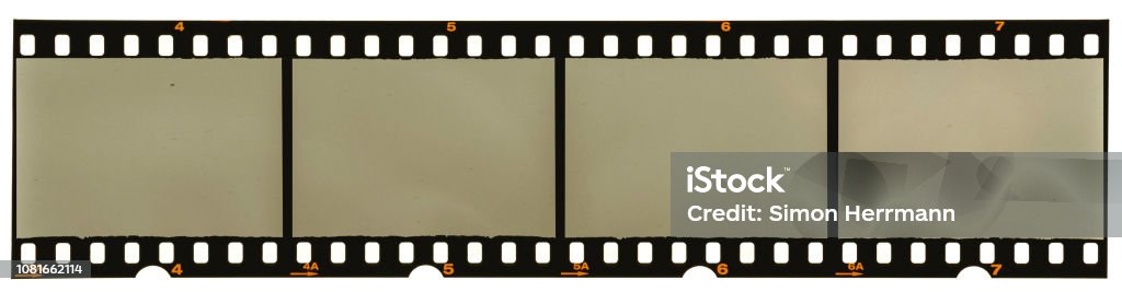 real high-res scan of an 35mm filmstrip on white background Camera Film Stock Photo