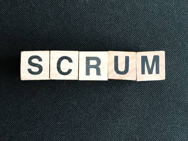 istock Scrum, wood cubes on black background 1081662206