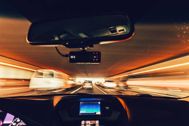 driving through an overpass tunnel during rush hour stock photo