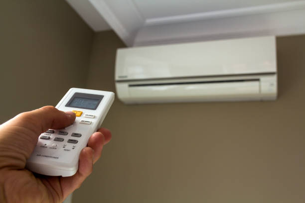 istock Hand holdind control switch of home air conditioner 1081664774
