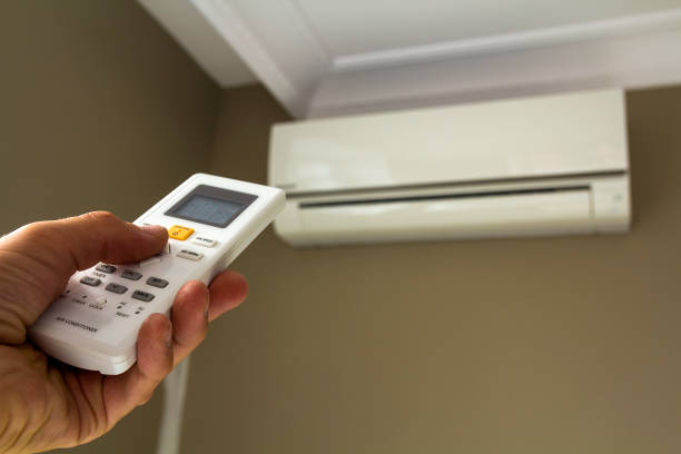 istock Hand holdind control switch of home air conditioner 1081664790