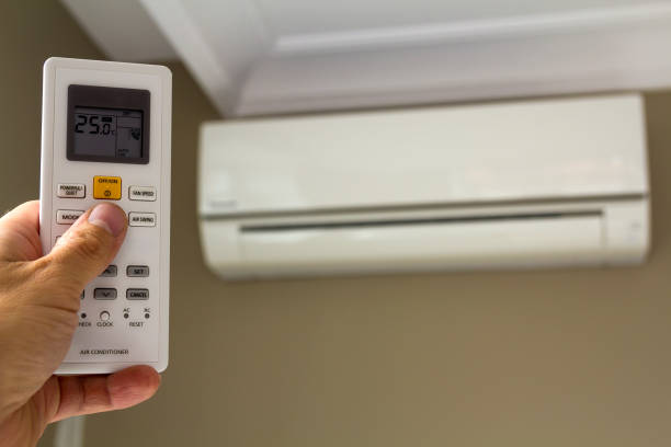 istock Hand holdind control switch of home air conditioner 1081664814
