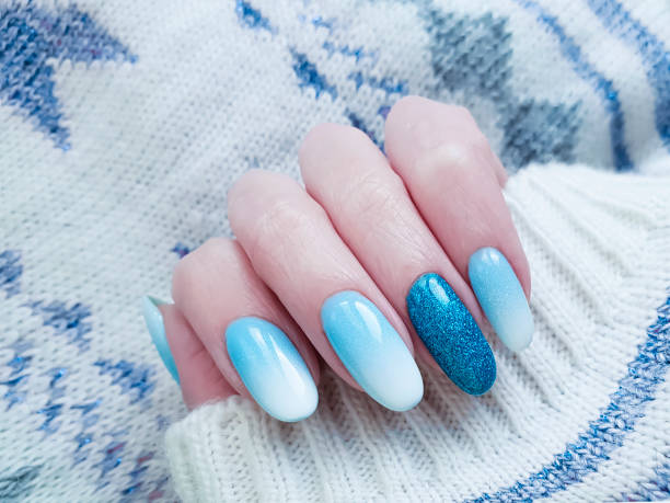 istock female hand beautiful manicure, sweater 1081665192