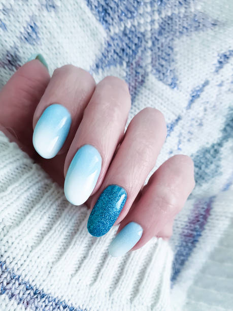 istock female hand beautiful manicure, sweater 1081668328