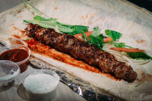 istock kebab beef with vegetables on flat cake, Oriental cuisine 1081670426