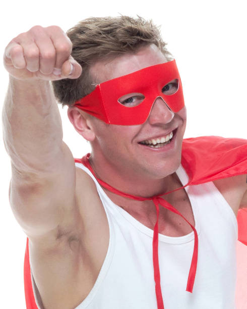 istock Man wearing pajamas and super hero cape 1081675304