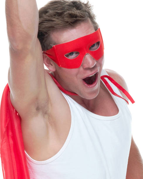 istock Man wearing pajamas and super hero cape 1081675318