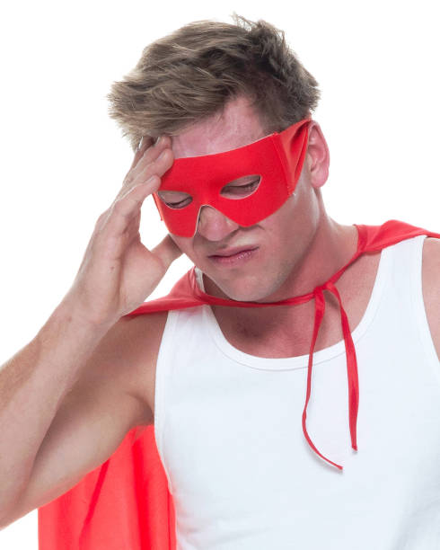 istock Man wearing pajamas and super hero cape 1081675320
