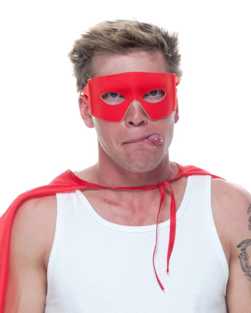 istock Man wearing pajamas and super hero cape 1081675322