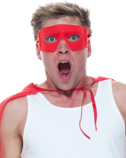 Man wearing pajamas and super hero cape