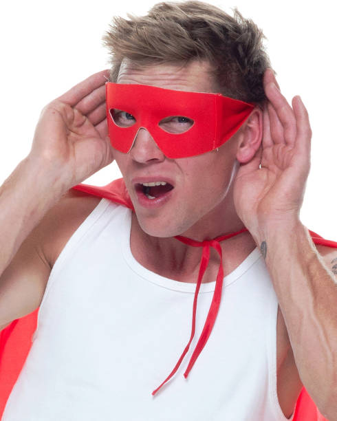istock Man wearing pajamas and super hero cape 1081675348