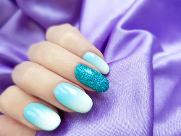 istock female hand beautiful manicure fabric silk 1081677600