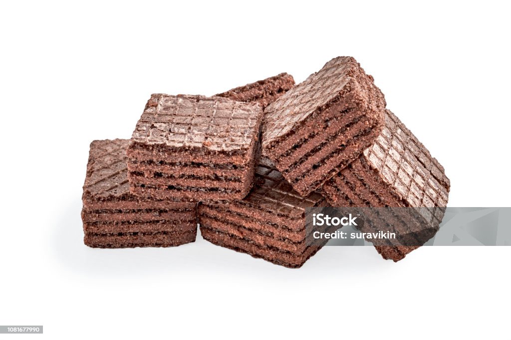 pile of chocolate square brownie wafer biscuits isolated on white pile of chocolate square brownie wafer biscuits isolated on white backdrop. closeup view Baked Stock Photo