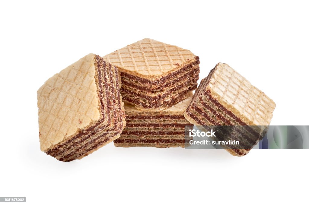 Pile of square wafer biscuits isolated on white backdrop. Pile of square wafer biscuits isolated on white backdrop. closeup view Baked Stock Photo