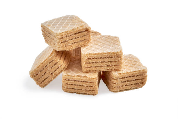 istock heap of chocolate square honey wafer biscuits isolated on white 1081678012