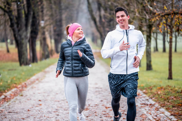 istock Athlete couple running outdoors 1081679596