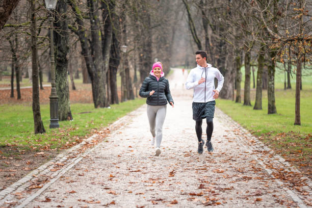 istock Athlete couple running outdoors 1081679600