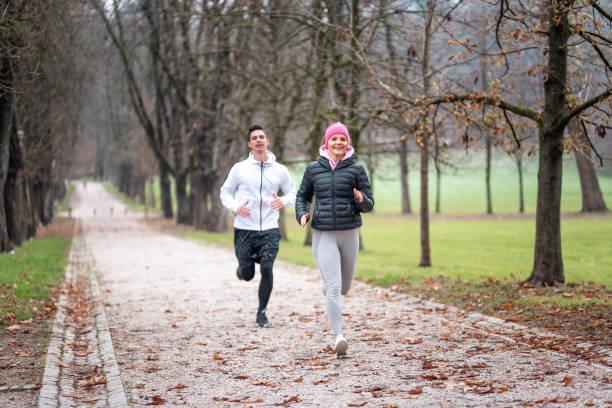 istock Athlete couple running outdoors 1081679604