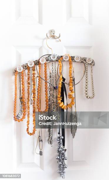 Amber Necklaces Organized On Fancy Hanger Stock Photo - Download Image Now - Hanging, Hook - Equipment, Jewelry