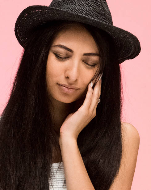 istock Beautiful female on pink background is crying 1081683128