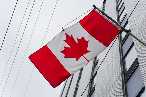 Canadian flag waving on the wind