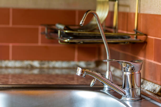 istock New shiny metal water faucet in modern kitchen 1081685018